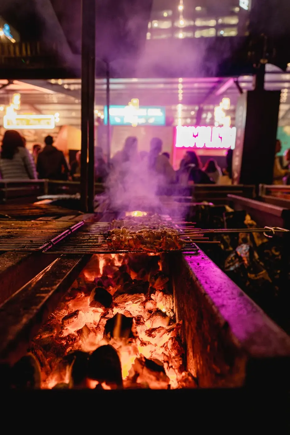 Athena souvlaki cooking over glowing charcoal at Tasting Australia