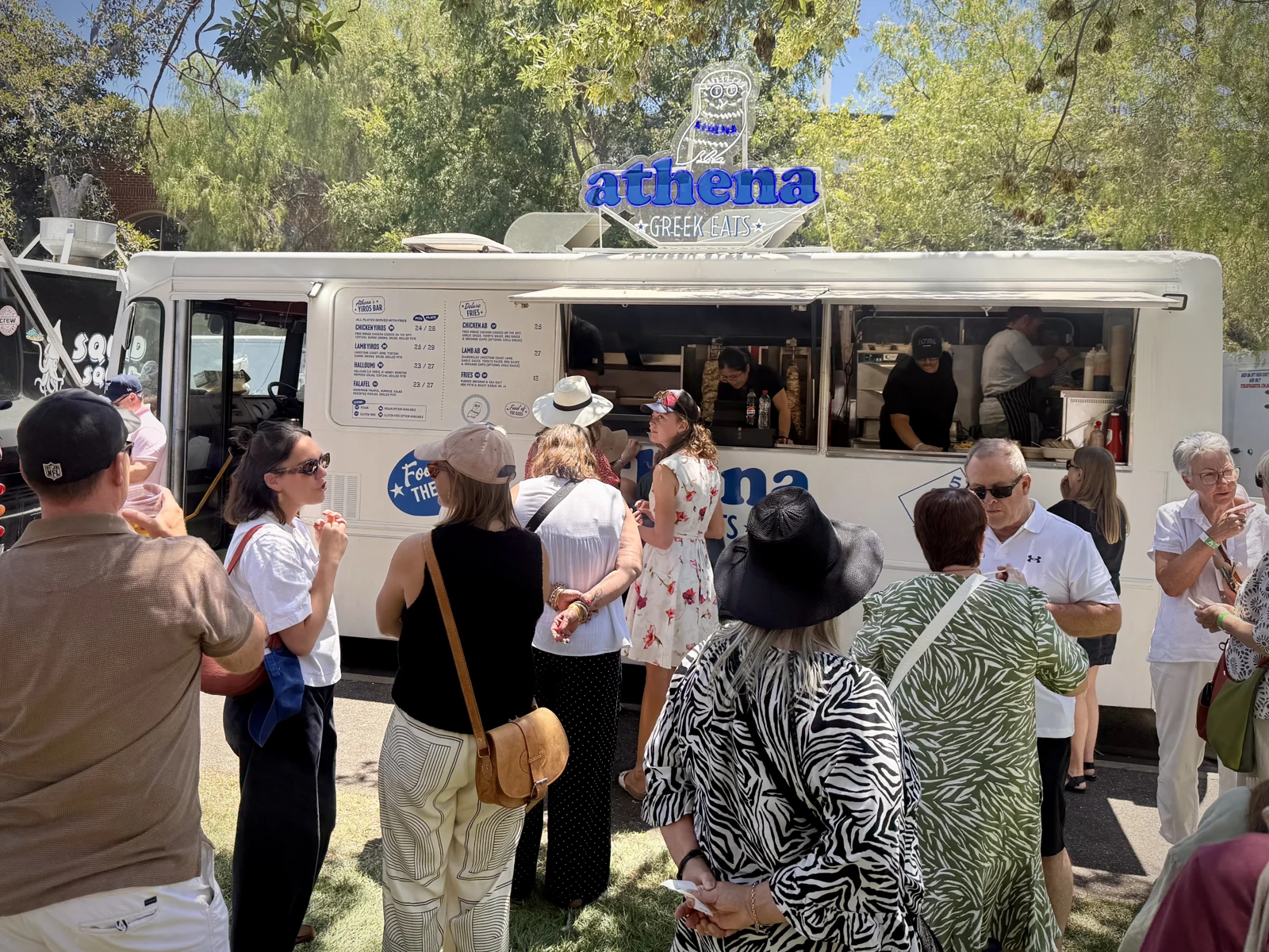 The Athena Greek Eats food truck serving guests at an outdoor event